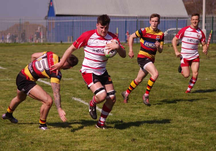 Flanker Ryan Mansell races clear for a try for Milford